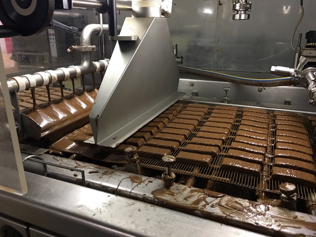 How we coat the muesli bars in chocolate