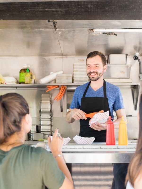 Food truck employee trained in basic food safety and hygiene by Food Safe.